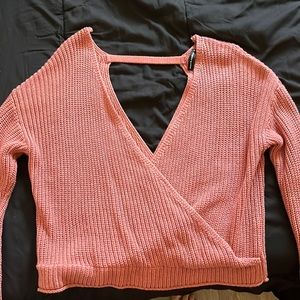 Pink knitted top. Open back. Md, can be worn as a Lg